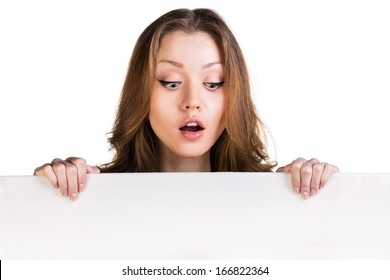 Close up business woman portrait. White background female portrait. Surprised girl hold white blank card.