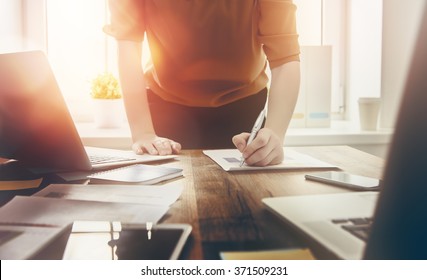 Close up business woman signing documents. - Shutterstock ID 371509231