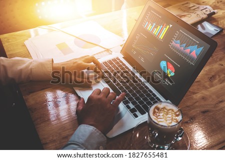 Close up businessman collecting data information converting into statistics, planning strategy gathering resources creating visual graphical graphs using computer laptop taking break lifestyle café 