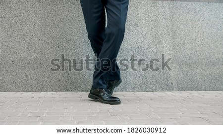 Similar – feet of a man standing inside a big puddle after a heavy rain