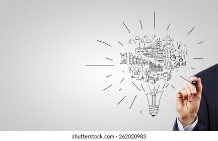 Close up of businessman hand drawing business strategy sketches - Shutterstock ID 262020983