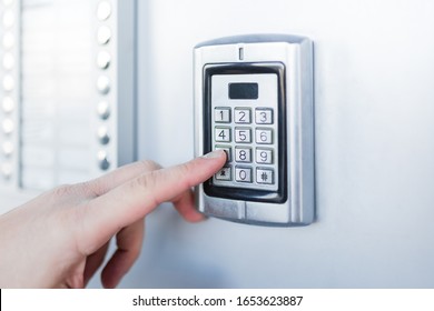 Close up of businessman hand entering security system code. - Shutterstock ID 1653623887