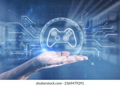 Close up of businessman hand holding creative joystick or gamepad hologram on blurry office interior background. Esport, gaming and fun concept. Double exposure - Powered by Shutterstock