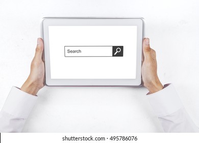 Close up of businessman hand holding a digital tablet with search bar on the screen, isolated on white background