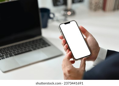 Close up businessman hand holding smartphone with blank screen for apps advertising. - Powered by Shutterstock