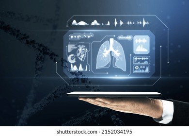 Close Up Of Businessman Hand Holding Tablet With Glowing Medical Hologram. Healthcare And Digital Transformation Concept. Blurry Dna Helix In The Background