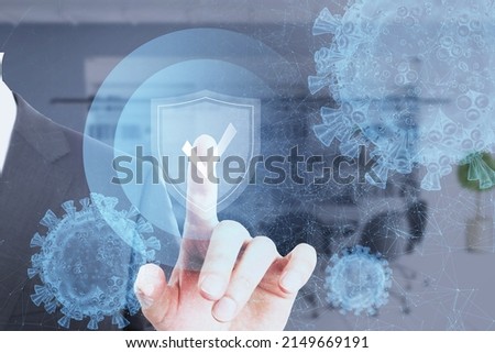 Close up of businessman hand pointing at antivirus protection shield on blurry background. Cyber attack and insurance concept. Double exposure