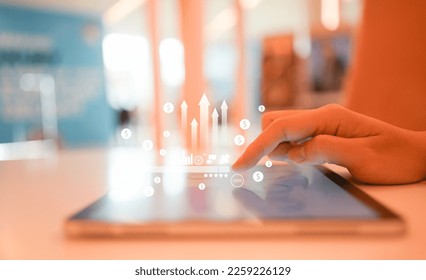 close up businessman hand touch screen on digital tablet to use marketing tool and check traffic research of pay per click program on web page for online b2b business and lifestyle concept - Shutterstock ID 2259226129