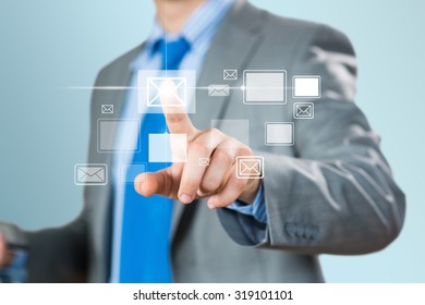Close up of businessman hand touching icon of media screen 