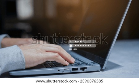 close up businessman hand type on laptop keyboard to access account on website by input username and password at office for security system of business technology concept