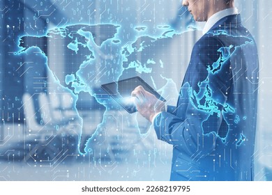 Close up of businessman hand using tablet with glowing binary code map hologram on blurry office interior background. Software and global technology concept. Double exposure