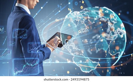Close up of businessman hands using tablet with creative binary coding globe on blurry background. World map and global business technologies concept. Double exposure