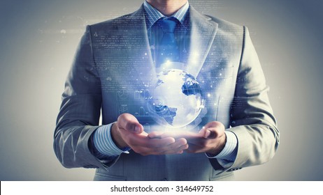 Close Up Of Businessman Holding Digital Globe In Palm