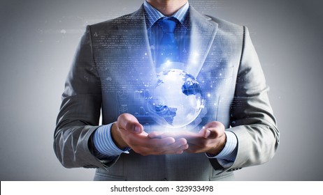 Close Up Of Businessman Holding Digital Globe In Palm