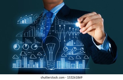 Close up of businessman sketching business project