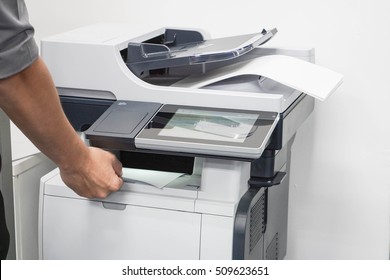 close up businessman take a business documents from printer