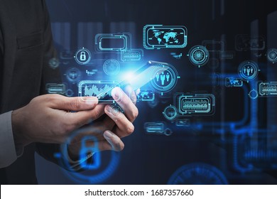 Close Up Of Businessman Using Smartphone In Blurry Office With Double Exposure Of Futuristic Infographics Interface. Concept Of Hi Tech And Big Data. Toned Image