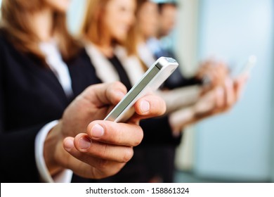 Close up of businessman using smartphone. Business concept - Powered by Shutterstock