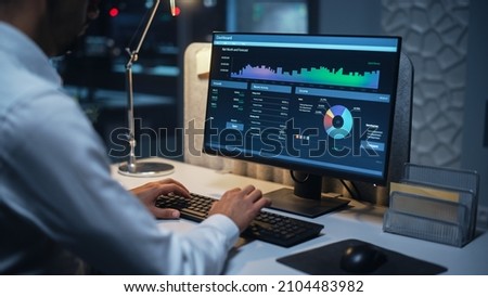 Close Up of a Businessman Working on Desktop Computer with Company's Growth, Statistics, Graphs and Pie Charts. Male Executive Director Managing Digital Projects, Typing Data, Using Keyboard and Mouse