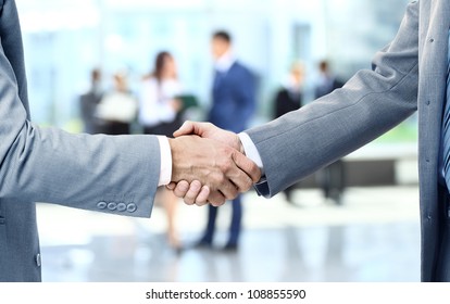 Close Up Of Businessmen Shaking Hands