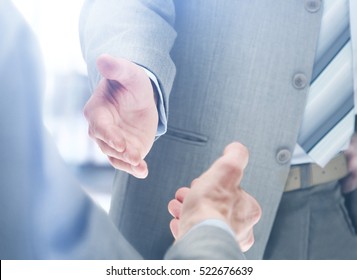 Close Up Of Businessmen Shaking Hands