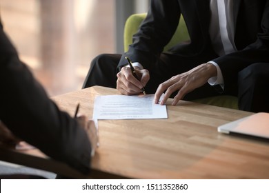 Close Up Businessmen Signing Partnership Agreement, Business Partners Making Legal Deal, Putting Signature On Official Paper Document, Taking Loan Or Purchase Property, Male Hands Holding Writing Pen