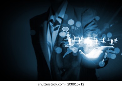 Close up of businessperson touching icon of media screen - Shutterstock ID 208815712