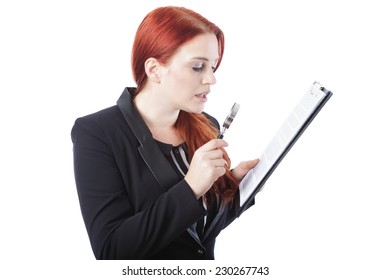 Close up Businesswoman with Burgundy Hair Reading a Report on Clipboard Using Magnifying Glass. Isolated on White Background.