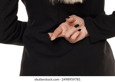 Close up businesswoman with her fingers crossed behind her back Concept for good luck or dishonesty business. - Powered by Shutterstock