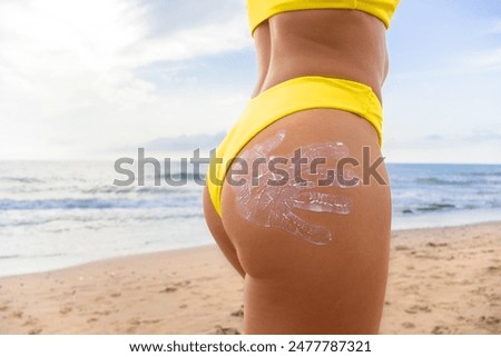 Similar – Anonymous woman applying sunscreen by the poolside