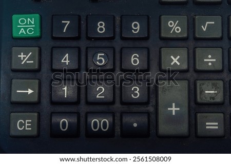 Close up of a calculator keypad with various function keys, including numbers, arithmetic operations, and special functions. Ideal for finance, education, and office related concepts.