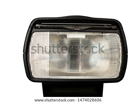 Close up of a camera flash or speedlight head for dslr or mirrorless photographic equipment isolated on white background.