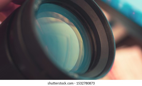 Close up camera lens with light reflection.