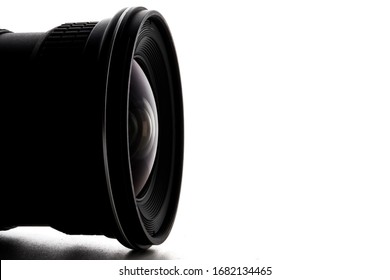Close up of camera lens with a white background.