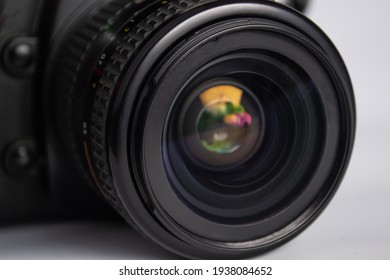 close up of camera photo lens on white background
