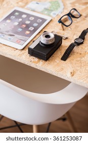 Close up of camera and smartphone lying on table
