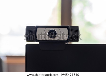 Close up camera webcam installed on the computer screen.
