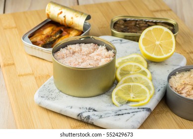 Close Up Of Can With Minced Crab Meat On A Cutting Board.