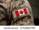 Close up of Canadian flag patch on military uniform.