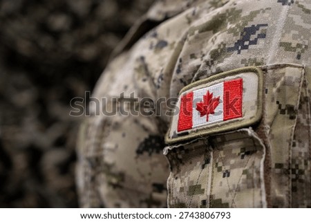 Close up of Canadian flag patch on military uniform.