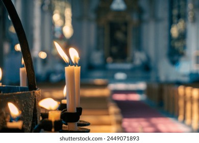 Close up of candles inside a church  - Powered by Shutterstock