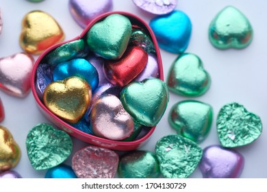 Close Up Of Candy In A Heart Shape Box On Table.