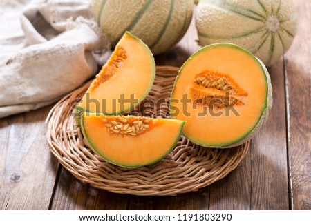 close up of cantaloupe melon on wooden table