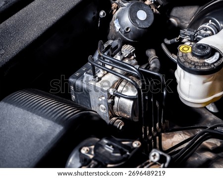 Close up of car ABS module in engine bay, automotive anti lock braking system maintenance and repair concept