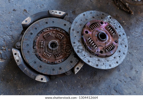 close up Car clutch and Pressure plate,Old and\
rusty clutch pressure plate assembly with clutch disc plate and fly\
wheel,blur,Soft focus.