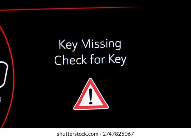 Close up of car dashboard key missing warning message.