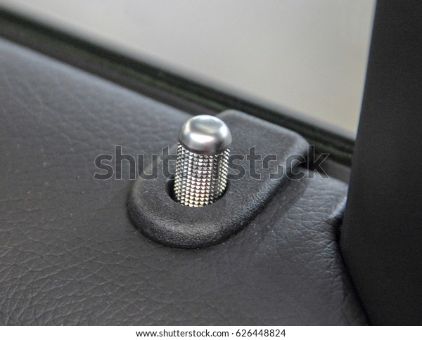 close up of car door lock\
indicator.