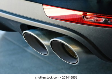 Close Up Of A  Car Dual Exhaust Pipe