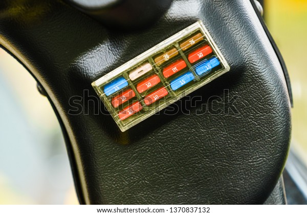 Close up of car fuse box\
in auto truck tractor machine vehicle. Electronics in\
transportation.