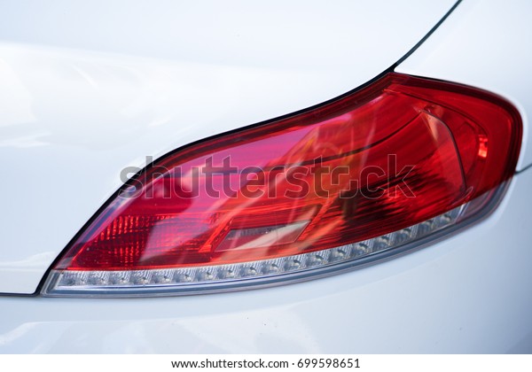 Close up car\
lights.Rear light of red super\
car